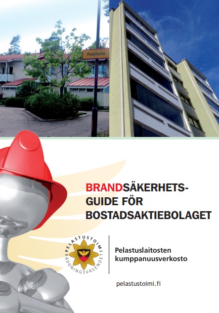 Rivitalo, kerrostalo ja nukke punainen kypärä päässä